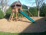 After Jim Bob's Lawn Care Installed Playmate® Play Area Wood Chips®